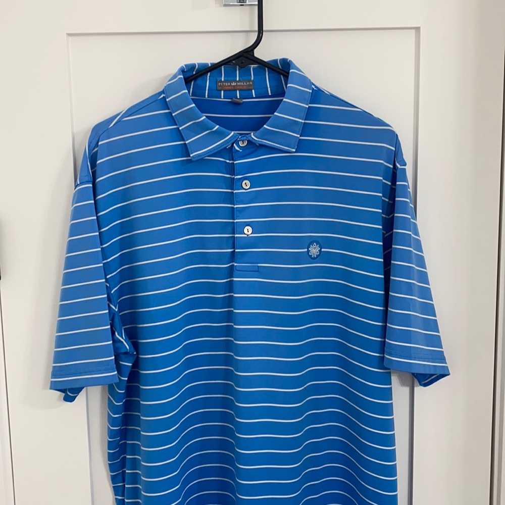 Blue and white striped Peter Millar golf shirt